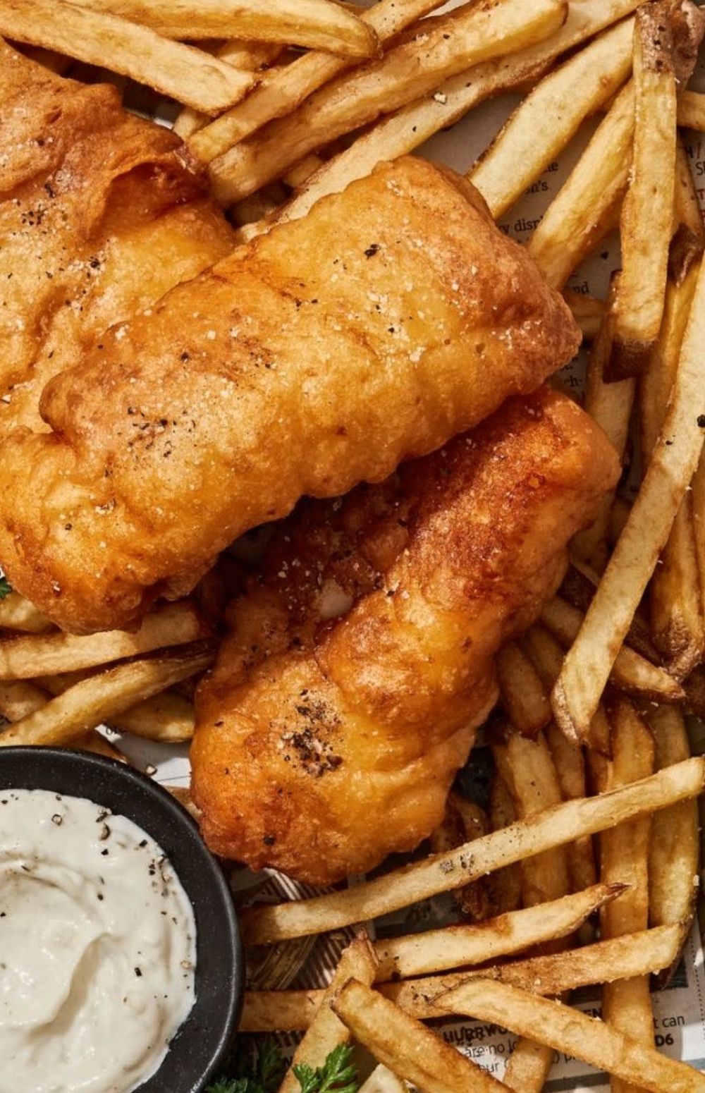 Golden battered fish and chips with tartar sauce